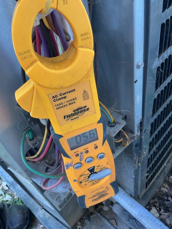 Completed scheduled preventive maintenance on a 5-year-old residential air conditioning system. Performed comprehensive system inspection of outdoor condenser unit, including visual assessment of cabinet condition, refrigerant line connections, and condensate drainage. Utilized Fieldpiece AC current clamp meter to measure amperage draw on compressor circuit, recording 0.50 amps during testing. Verified proper electrical connections and component operation. Condenser unit found in good operating condition with no deficiencies noted. System operating within normal parameters upon completion of tune-up service.
