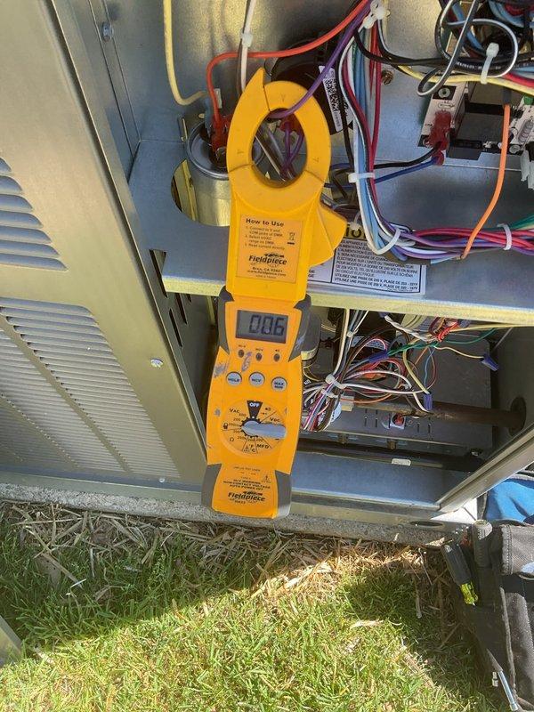 Completed planned maintenance on 10-month-old HVAC system during second service visit. Performed electrical diagnostics on outdoor condensing unit using clamp meter, measuring amperage draw at 0.16 amps to verify proper compressor and fan motor operation. Inspected internal electrical components, capacitors, control boards, and wiring connections for proper function and signs of wear. All electrical parameters within manufacturer specifications. Additionally inspected water heater during visit, noting unit manufactured in January 2000 with visible condensation on exterior surface. System operating as designed with no immediate concerns identified.