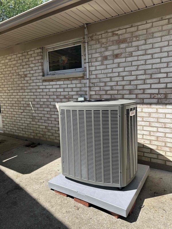 Completed installation of 3-ton, 19 SEER heat pump system with matching air handler. Installed outdoor condensing unit on concrete pad against exterior wall with refrigerant lines properly routed and secured to building structure, connected indoor air handler, performed system startup and commissioning procedures including refrigerant charge verification using digital manifold gauges to ensure proper operating pressures and temperatures for optimal system performance.