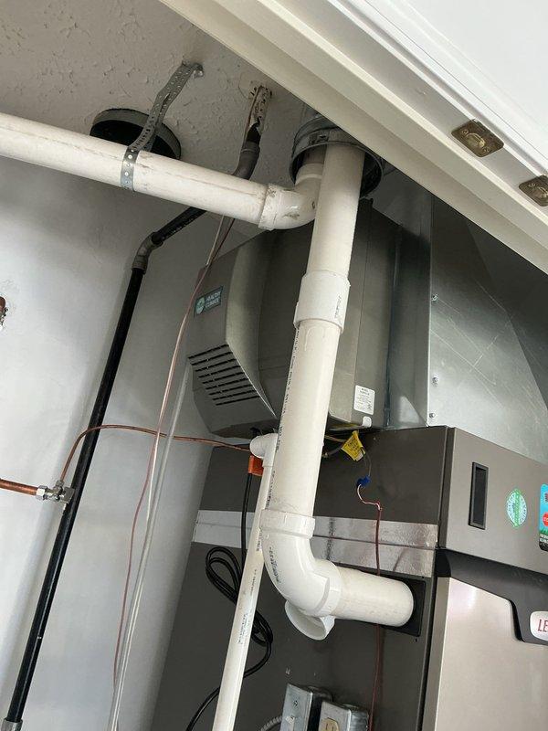 Completed follow-up installation of whole-home humidifier system on existing HVAC air handler unit. Connected humidifier water supply line using copper piping with brass compression fittings and shut-off valve for maintenance access. Verified proper integration with forced air system and tested unit operation to ensure adequate humidity distribution throughout the home.