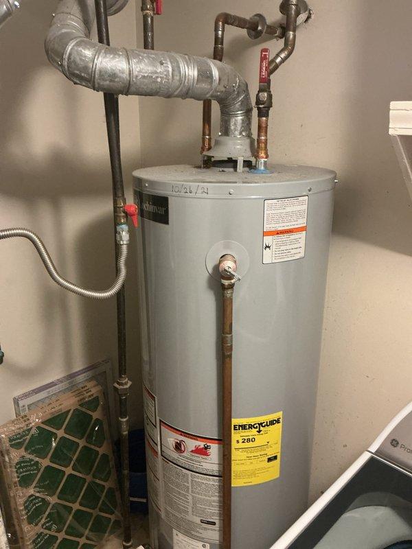 Responded to no hot water complaint on five-year-old Reliance residential water heater. Performed diagnostic inspection of unit and plumbing connections, verified all safety valves and shut-off controls were properly functioning, and documented current condition of water heater system with copper and galvanized piping configuration. Unit and installation photographed for service records.