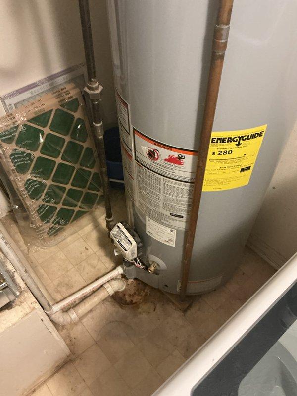 Responded to no hot water complaint on five-year-old Reliance residential water heater. Performed diagnostic inspection of unit and plumbing connections, verified all safety valves and shut-off controls were properly functioning, and documented current condition of water heater system with copper and galvanized piping configuration. Unit and installation photographed for service records.
