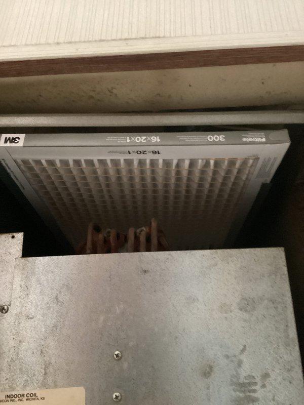 Completed comprehensive HVAC system estimate for replacement of aging Coleman Evcon Presidential equipment showing significant wear, dirt accumulation, and operational concerns. Documented existing indoor coil unit and air handler configuration, photographed current filter installation (3M 16x20x1), and assessed overall system condition to provide customer with Green A+ rated replacement options for improved efficiency and reliability.