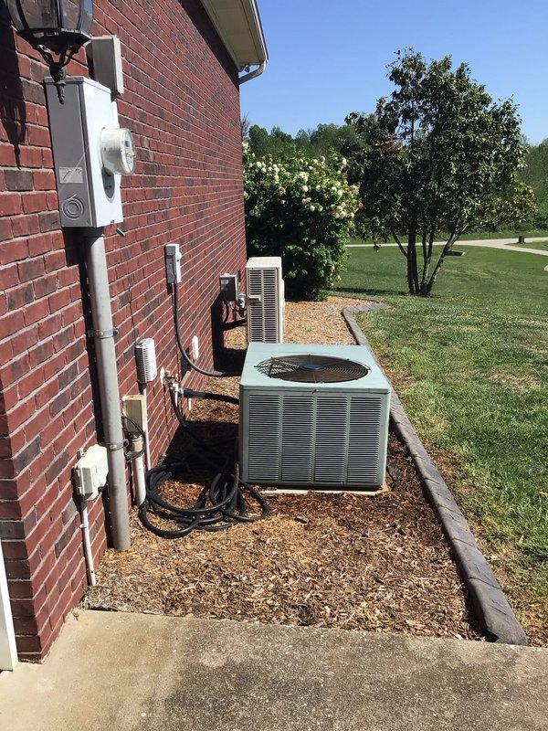 Completed dismissed visit on single-system residential HVAC installation. Performed visual inspection of Rheem furnace unit located in interior mechanical closet and outdoor air conditioning condenser positioned on exterior concrete pad. Verified proper installation of white PVC venting system, electrical connections via flexible conduit to wall-mounted disconnect, and gas line connections at furnace base. Inspected outdoor condenser unit including fan grille, horizontal louvers, electrical disconnect box, and PVC conduit routing along brick exterior wall. Documented equipment conditions and installation components through photographic records. All visible system components appeared properly installed with no immediate service concerns noted during dismissed visit inspection.