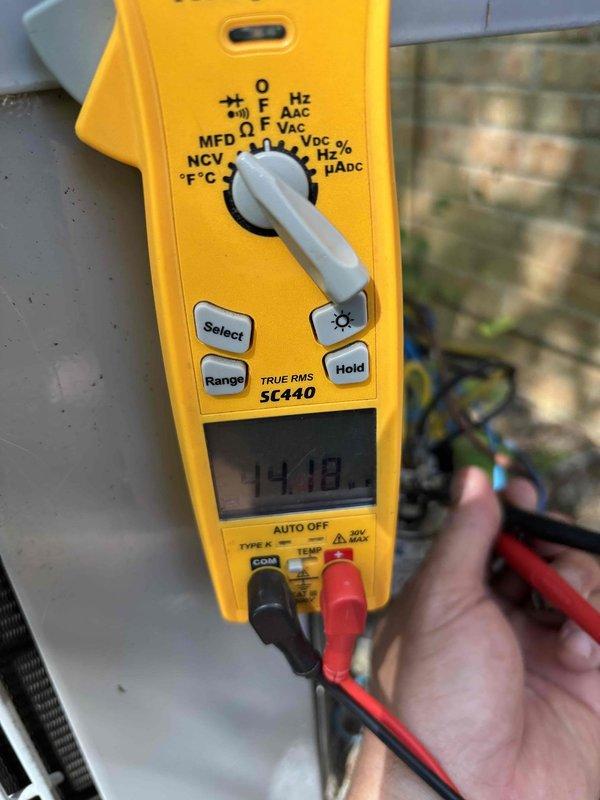 Completed Gold Level planned maintenance on an 11-year-old single-system HVAC unit during first visit. Performed comprehensive system diagnostics including electrical measurements with digital multimeter, recording voltage readings of 14.18V, and conducted thorough inspection of evaporator coil assembly and refrigerant lines. All components found operating within normal parameters, with minor dust accumulation noted on heat exchanger surfaces and metal panels.