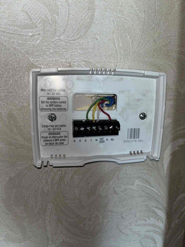 Completed HVAC replacement estimate for 16-year-old Lennox system experiencing reduced performance. Evaluated existing electrical panel configuration and thermostat wiring setup, documenting current 24VAC low-voltage control wiring with standard color-coded connections at terminal block. Assessed residential electrical infrastructure capacity and compatibility for new equipment installation, photographed existing system components and electrical connections to provide comprehensive replacement recommendations.