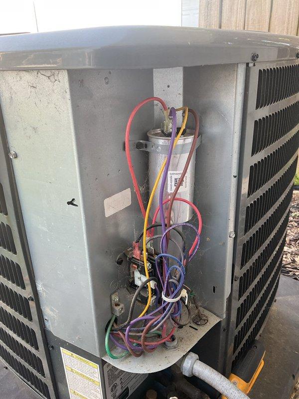 Completed planned maintenance visit on residential HVAC system with 12x24x1 filter specification in its fifth year of service. Performed comprehensive inspection of outdoor condensing unit and indoor air handler, accessing internal components to verify proper operation of capacitor, wiring connections, and blower motor assembly. Documented system condition with photography showing condenser coils, electrical connections, control board, and heat exchanger sections for maintenance records.