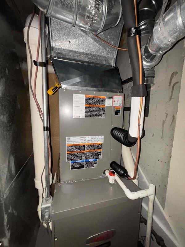 Completed installation of new air conditioning system with evaporator coil integrated with existing furnace unit. Installed copper refrigerant lines, insulated suction line, and connected indoor coil to outdoor condensing unit. Verified proper refrigerant charge using digital manifold gauges, confirming system superheat reading of 0.35 degrees. Installed condensate drain lines with PVC piping and safety float switch to prevent overflow. Routed all refrigerant lines and electrical connections per manufacturer specifications, securing lines properly to prevent vibration and wear. System tested and operational, providing proper cooling capacity for the residence.