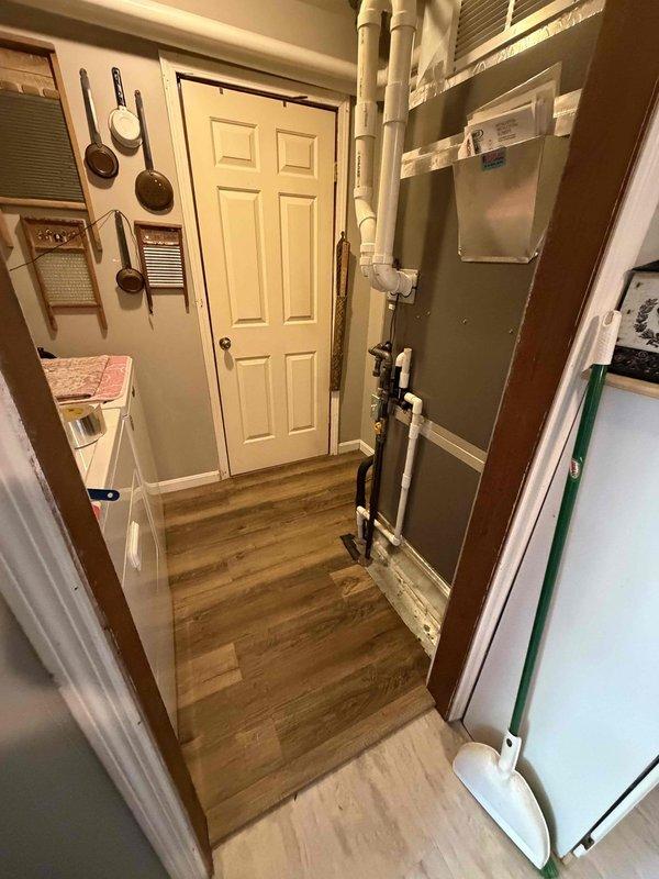 Responded to no cooling complaint on 3-year-old residential system experiencing short cycling with unit shutting down after 30 seconds of operation and no airflow through vents. Performed diagnostic evaluation and determined warranty evaporator coil failure as root cause of system malfunction. Documented equipment condition with photographic evidence showing indoor air handler installation and outdoor condensing unit. Coordinated with customer per warranty protocol for coil replacement authorization and scheduling.