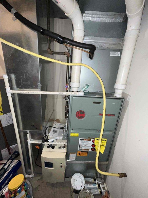 Conducted comprehensive HVAC replacement estimate for residential property. Evaluated existing system including Rheem furnace, heat pump configuration, associated ductwork, humidification equipment, and thermostat controls. Documented current equipment condition, noting flexible gas line connections, PVC venting system, refrigerant line routing, air filtration components, and multi-stage thermostat wiring with heat pump conventional setup. Photographed mechanical room installation and thermostat terminal connections to provide accurate assessment for complete system replacement recommendations.