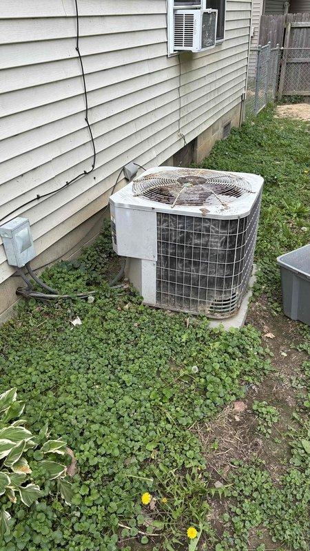 Conducted comprehensive HVAC replacement estimate for residential property. Evaluated existing outdoor air conditioning condenser unit showing signs of age and weathering, with discoloration on exterior surfaces. Assessed indoor tankless Carrier water heater installation in utility closet with digital control panel and proper copper piping connections. Documented current system configuration including electrical connections, condensate drainage, and equipment placement. Provided detailed replacement options and discussed available financing programs and payment plan structures to accommodate budget requirements.