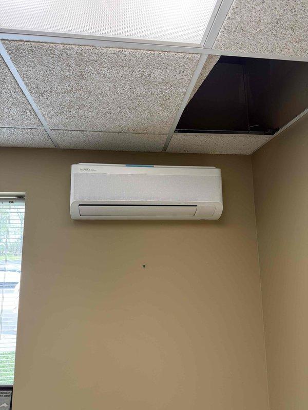 Completed installation of a 48,000 BTU Lennox mini split system with five indoor air handling units throughout the facility. Mounted wall-hung evaporator units in multiple rooms including office spaces, routed refrigerant lines and condensate drainage through ceiling plenum, and installed exterior condensing unit. All units tested and verified operational with proper airflow and temperature differential.