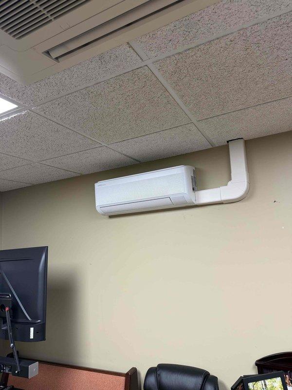 Completed installation of a 48,000 BTU Lennox mini split system with five indoor air handling units throughout the facility. Mounted wall-hung evaporator units in multiple rooms including office spaces, routed refrigerant lines and condensate drainage through ceiling plenum, and installed exterior condensing unit. All units tested and verified operational with proper airflow and temperature differential.