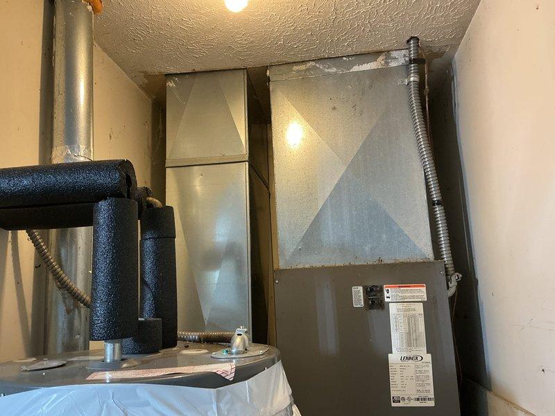 Completed comprehensive HVAC replacement estimate for residential property, evaluating existing Lennox furnace/air handler system installed in confined utility space alongside water heater. Assessed electrical panel capacity and circuit breaker configuration to determine compatibility with proposed replacement equipment and verified adequate power supply for new system installation.