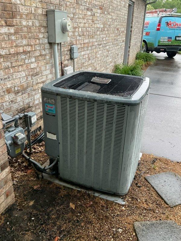 Responded to no cooling complaint on 13-year-old residential air conditioning system. Upon arrival, confirmed indoor blower motor operational but outdoor condensing unit not running with thermostat reading 70 degrees. Performed visual inspection of outdoor unit and electrical panel. Verified all circuit breakers in proper position with no tripped breakers found. Inspected condenser unit exterior condition, noting age-appropriate wear and weathering on cabinet. Checked electrical connections at disconnect and main panel. Diagnosed failure of outdoor condensing unit to energize while indoor air handler continued normal operation, indicating potential compressor contactor, capacitor, or control board failure requiring further electrical testing and component replacement to restore cooling function.