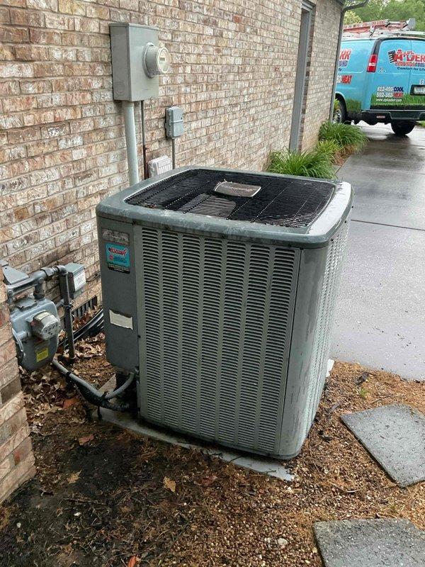 Conducted comprehensive HVAC system replacement estimate at residential property. Evaluated existing outdoor air conditioning condenser unit positioned on concrete pad against exterior brick wall, including assessment of copper refrigerant lines, electrical disconnect, and conduit connections to meter box. Inspected indoor furnace unit and water heater located in utility room, documenting equipment specifications, ductwork configuration, and existing infrastructure to provide complete system replacement recommendations for improved energy efficiency and performance.