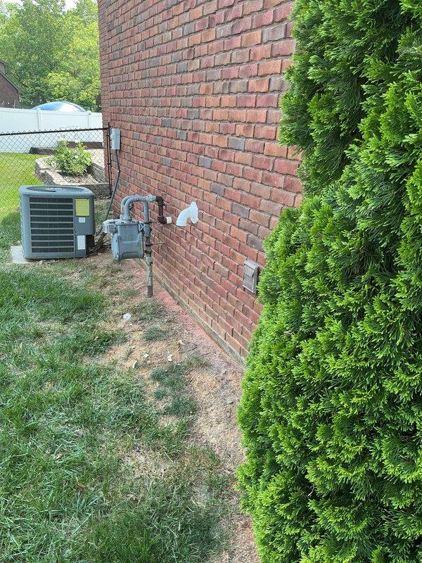 # Tankless Water Heater Installation

Successfully installed a GREEN tankless water heater system at a residential property. The installation included proper venting through the exterior brick wall using white PVC piping with appropriate elbow fittings to ensure code-compliant exhaust routing. All connections were secured, tested for proper operation, and the unit was commissioned to manufacturer specifications. The system is now providing on-demand hot water with improved energy efficiency compared to traditional tank-style water heaters.