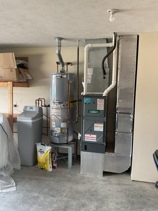 Completed Platinum Level annual maintenance on 6-year-old HVAC system. Inspected furnace unit and water heater installation, verified proper operation of all components, replaced 16x25x2 air filter, checked PVC condensate drainage system, and documented equipment condition with photos. All systems operating within normal parameters with no issues identified during this first annual visit.