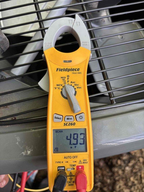Completed scheduled HVAC system maintenance and tune-up per campaign notification. Performed comprehensive diagnostic testing using clamp meter to verify system electrical performance, recording capacitance reading of 493 microfarads and operational amperage of 39.15 amps at the outdoor condensing unit. All measurements within acceptable parameters, confirming proper system operation and electrical integrity.