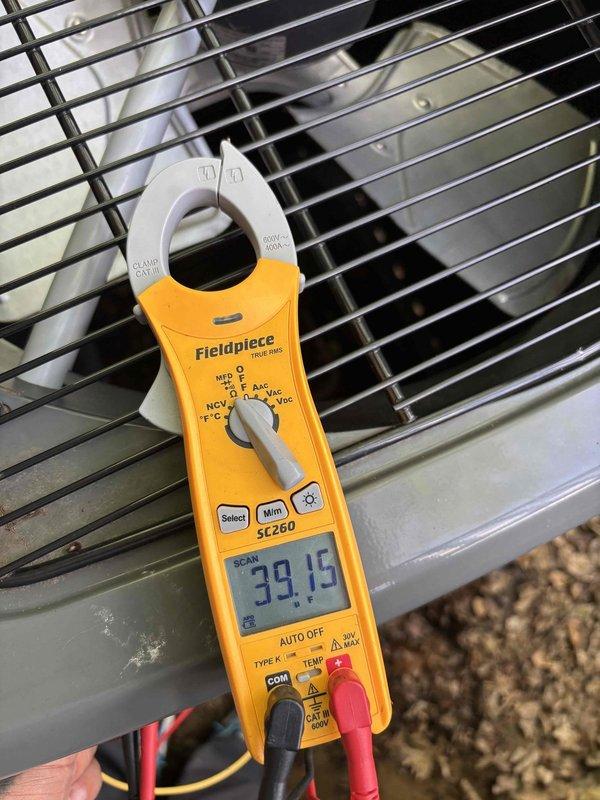 Completed scheduled HVAC system maintenance and tune-up per campaign notification. Performed comprehensive diagnostic testing using clamp meter to verify system electrical performance, recording capacitance reading of 493 microfarads and operational amperage of 39.15 amps at the outdoor condensing unit. All measurements within acceptable parameters, confirming proper system operation and electrical integrity.