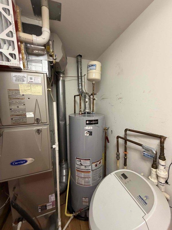 Installed new metal flue pipe for Lochinvar water heater, routing through utility room ceiling and terminating through standing seam metal roof. Ensured proper venting clearances, sealed roof penetration, and verified draft operation upon completion.
