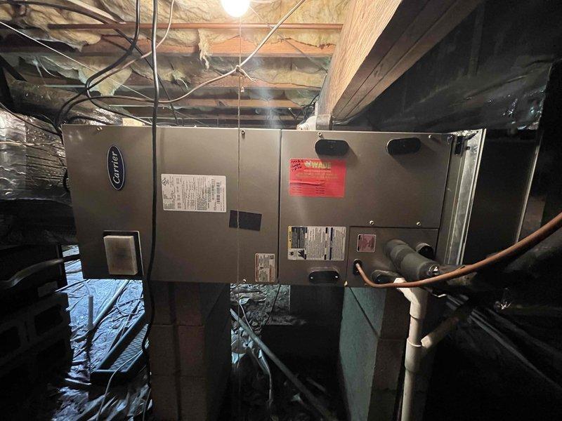 Conducted comprehensive assessment of HVAC ductwork system in crawlspace of 1,375 square foot residential property to provide estimate for indoor air quality improvements. Inspected existing Carrier air handler unit and identified three deteriorated flexible duct runs requiring replacement. Evaluated current ductwork configuration, measured run lengths, and assessed accessibility for installation in confined crawlspace environment with existing radiant barrier insulation. Documented system layout including supply and return air pathways, connection points at plenum, and routing through floor joists. Photographed existing equipment installation, ductwork conditions, and workspace constraints to develop accurate scope of work. Prepared detailed estimate for replacement of three flexible duct runs with properly sized, insulated flex duct to restore system efficiency and improve indoor air quality throughout residence.