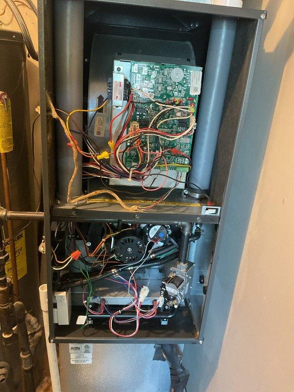 Completed Platinum Maintenance service on 2-year-old HVAC system during second scheduled visit. Performed comprehensive inspection of furnace unit and air handler, accessed internal components including control board, blower assembly, and gas valve to verify proper operation and connections. Installed new 20x20x5 filter and documented system condition with photos for maintenance records.