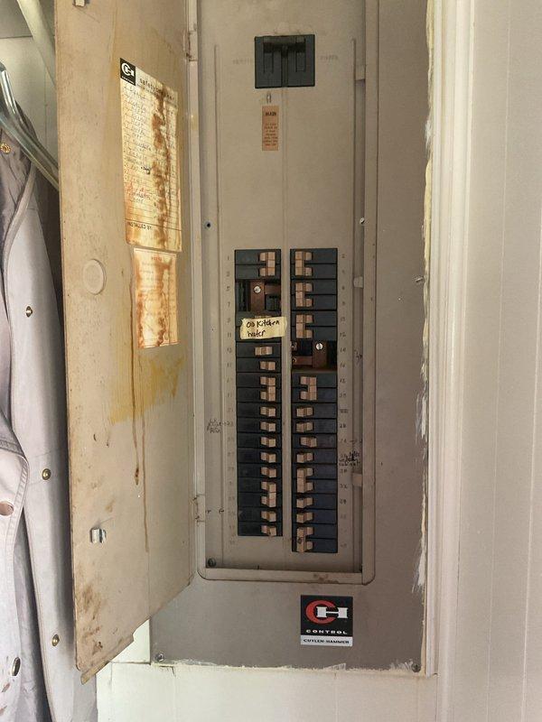 Conducted comprehensive estimate for mini-split system installation to replace existing window unit and floor heating setup. Evaluated electrical panel capacity and condition, noting moisture damage and rust on panel door which may require remediation prior to installation. Assessed structural framing and available ductwork pathways in utility area to determine optimal equipment placement and line set routing for new ductless mini-split system.