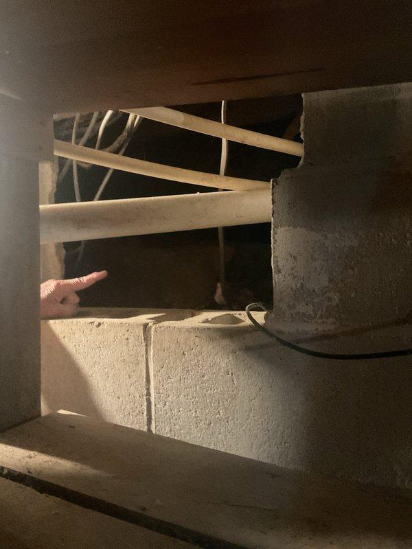 Conducted comprehensive estimate for mini-split system installation to replace existing window unit and floor heating setup. Evaluated electrical panel capacity and condition, noting moisture damage and rust on panel door which may require remediation prior to installation. Assessed structural framing and available ductwork pathways in utility area to determine optimal equipment placement and line set routing for new ductless mini-split system.