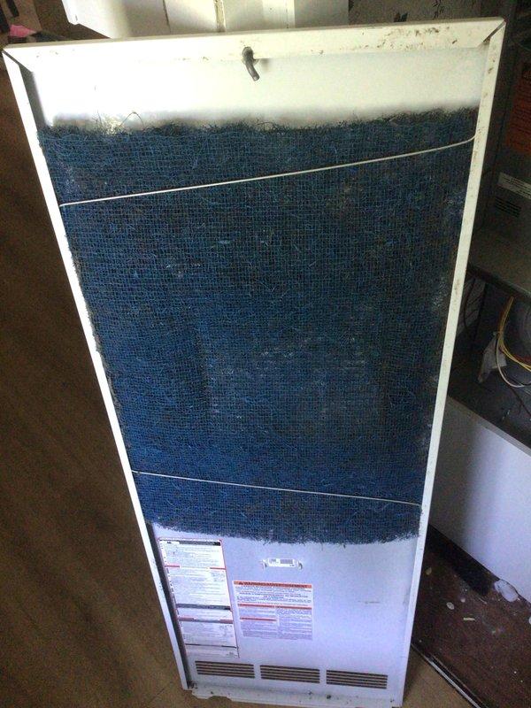 Completed annual Gold Level planned maintenance on 2-year-old HVAC system. Performed comprehensive inspection of air handler unit, evaluated Honeywell Home ProSeries thermostat operation displaying 61°F, and documented heavily soiled air filter requiring replacement due to significant dust and debris accumulation affecting system efficiency.