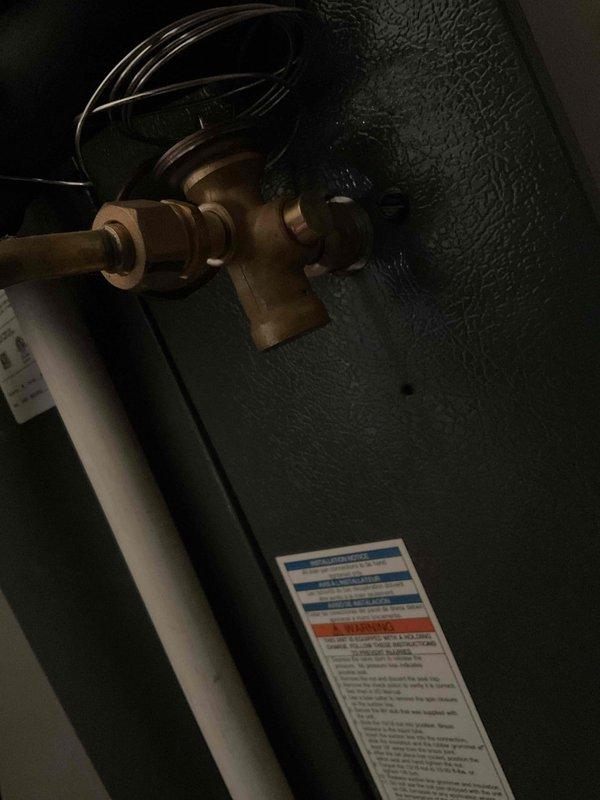 Completed annual second visit Platinum Level maintenance on 5-year-old HVAC system. Inspected evaporator coil and TXV valve assembly with copper line connections, documenting condition with photos showing brass service ports and equipment labels in mechanical space. Replaced 16x20x5 air filter and performed comprehensive system checks per Platinum maintenance protocol. Identified need for evaporator coil and TXV replacement, estimated 4-hour repair timeframe for future service. All maintenance items completed successfully, system operating within normal parameters at time of service completion.