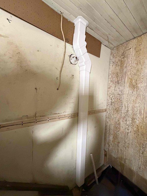 Completed installation of 3-ton multi-zone ductless mini-split system with three indoor head units. Installed indoor air handler unit in residential living space with proper wall mounting, refrigerant line connections, and condensate drainage routing through vertical PVC pipe system. System tested and verified operational upon completion.