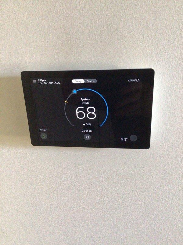 Completed first annual planned maintenance visit on Gold Level single-system home with 1-year-old HVAC equipment. Performed comprehensive system inspection of indoor and outdoor units, verified thermostat operation showing 68°F inside temperature with 61% humidity and proper cooling setpoint of 72°F, checked outdoor condenser unit positioned on pad with clear airflow through louvers, confirmed electrical connections and disconnect box functionality, and installed 20x25x5 filter. All components operating within normal parameters with no issues identified.