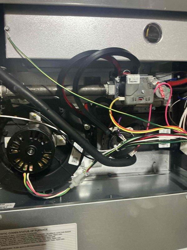 Responded to install callback for reported gas odor in basement furnace room. Upon arrival, inspected recent furnace installation and gas line connections. Located source of gas smell at flexible gas connector fitting to furnace inlet. Tightened connection at appliance connector and black iron pipe assembly, verified proper seal with leak detection solution, and confirmed no further gas odor present. System remained operational throughout service call with all components functioning properly.