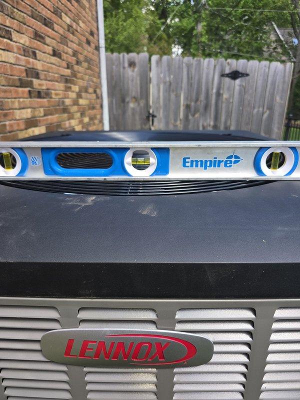 Responded to follow-up service request to level Lennox heat pump unit that was previously identified as requiring adjustment. Upon arrival, assessed unit positioning using spirit level and confirmed equipment was not properly leveled on existing pad. Adjusted heat pump to manufacturer specifications to ensure proper drainage, optimal compressor operation, and equipment longevity. Verified unit stability and levelness in all directions before completing service.