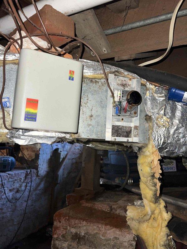 Conducted comprehensive HVAC system replacement estimate at residential property during requested evening timeframe. Evaluated existing operational system including crawl space installation with current air handler, MAC 2000 media air cleaner, flexible metallic ductwork, and plenum connections. Assessed accessibility constraints in confined space with exposed wooden framing, copper piping, electrical components, and existing insulation conditions. Documented equipment specifications, ductwork configuration, and installation environment through photographic survey to develop replacement system recommendations and ensure homeowner presence for consultation regarding upgrade options.
