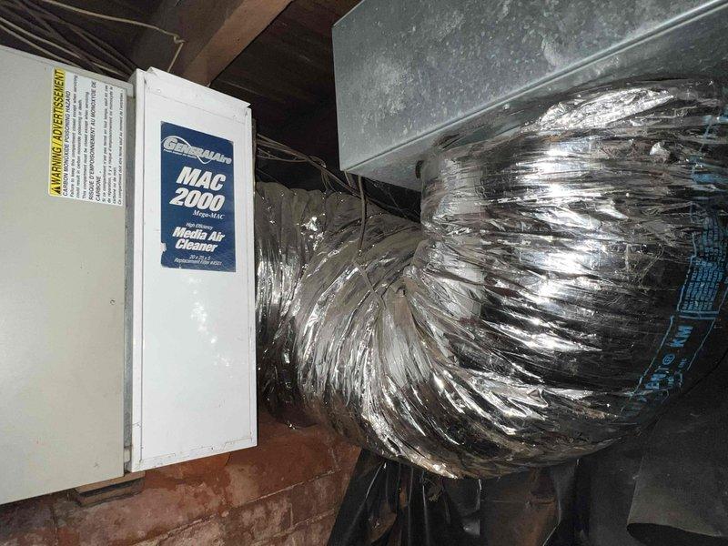Conducted comprehensive HVAC system replacement estimate at residential property during requested evening timeframe. Evaluated existing operational system including crawl space installation with current air handler, MAC 2000 media air cleaner, flexible metallic ductwork, and plenum connections. Assessed accessibility constraints in confined space with exposed wooden framing, copper piping, electrical components, and existing insulation conditions. Documented equipment specifications, ductwork configuration, and installation environment through photographic survey to develop replacement system recommendations and ensure homeowner presence for consultation regarding upgrade options.