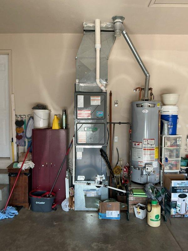 Completed annual planned maintenance on 8-year-old residential HVAC system with 20x20x5 filter specification. Performed comprehensive inspection of indoor air handler unit located in garage and outdoor condensing unit, checking all mechanical and electrical components, refrigerant levels, and airflow systems. Verified proper operation of both heating and cooling functions, cleaned condenser coils, replaced air filter, and confirmed system is operating within manufacturer specifications for continued reliable performance.