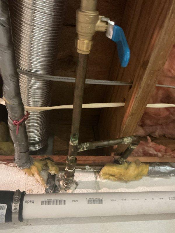 Completed installation of customer-supplied Delta Loraine kitchen faucet with double-handle assembly and pull-out spray head on existing double-basin stainless steel sink. Replaced exterior hose bib accessible from basement, installing new brass frost-free sillcock with ball valve shutoff. Both fixtures tested and verified operational with no leaks detected.