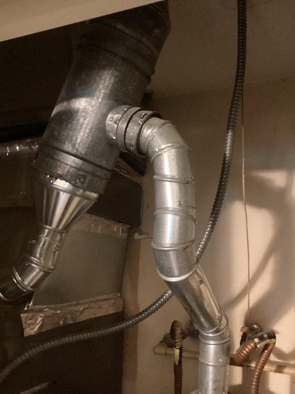 Responded to inquiry regarding water heater replacement options for residential property. Conducted on-site evaluation of existing gas-fired tank-style water heater located in mechanical room alongside HVAC equipment. Assessed current installation including gas supply lines, venting configuration, electrical connections, and available clearances for potential equipment upgrades. Documented existing conditions showing standard residential water heater with gas control valve, flexible gas connector, and proper safety labeling. Evaluated HVAC ductwork routing and utility connections to determine feasibility of both traditional tank-style and tankless water heater installations. Discussed advantages and specifications of both system types with homeowner, including energy efficiency considerations, space requirements, and installation parameters. Provided comprehensive estimate for replacement options based on site conditions and customer preferences.