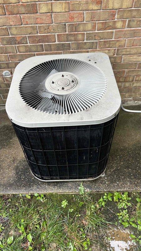 Conducted comprehensive replacement estimate for residential HVAC system with non-operational air conditioning unit and aging furnace exceeding ten years of service life. Evaluated existing outdoor condenser unit with protective mesh grille mounted on concrete pad, assessed electrical disconnect box with metallic flex conduit installation, and documented overall system condition through photographic documentation. Provided homeowner with replacement options and recommendations for complete system upgrade due to advanced age and current cooling system failure.