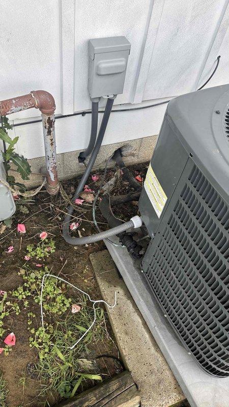 Conducted on-site assessment for complete ductwork replacement estimate to supplement existing HVAC system quote. Documented existing conditions including severely deteriorated copper refrigerant lines showing extensive corrosion and surface degradation, compromised exterior mechanical components, and structural areas exhibiting rust staining and moisture damage indicative of long-term system wear. Provided comprehensive photographic documentation of current installation conditions to support ductwork replacement proposal.