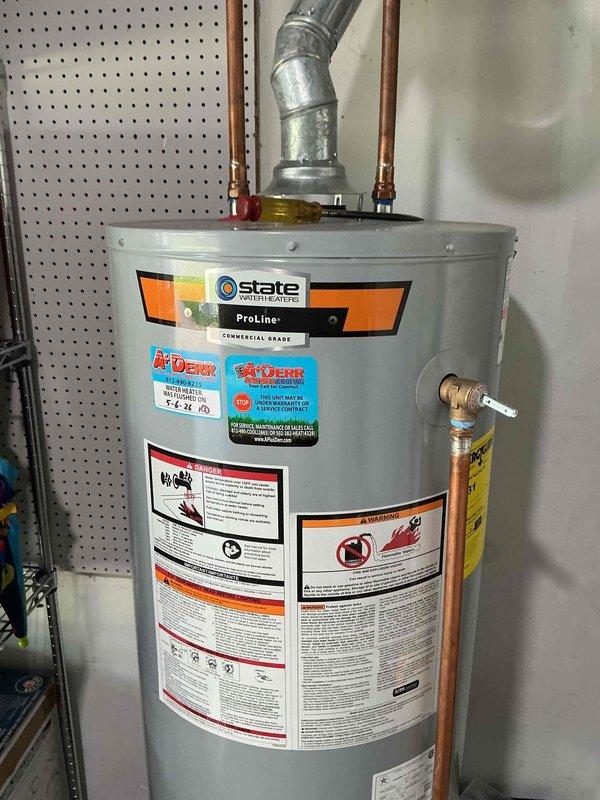 Performed comprehensive maintenance flush on State ProLine commercial-grade tanked water heater. Drained sediment buildup from tank bottom through drain valve, flushed system with fresh water to remove mineral deposits and debris, and inspected all connections including copper supply lines, pressure relief valve, and gas control assembly. Verified proper operation of temperature and pressure relief valve, checked all plumbing connections for leaks, and confirmed unit returned to normal operating parameters upon completion.