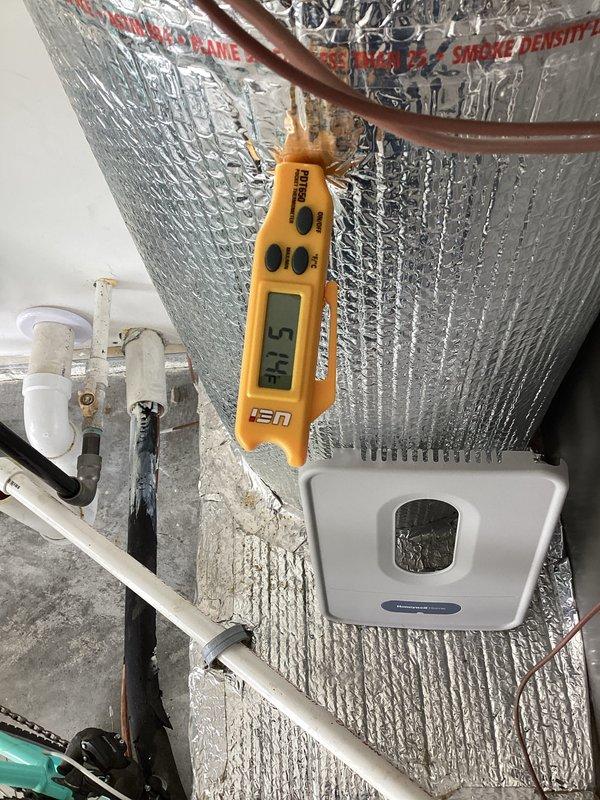 # HVAC Maintenance - Planned Single Maintenance

Completed annual preventive maintenance inspection on residential HVAC system. Performed system diagnostics using digital manometer, recording pressure readings of 16.1 on both P1 and P2 ports to verify proper refrigerant charge and system performance. Inspected attic-mounted air handler unit, ductwork with reflective foil insulation, copper refrigerant lines, and condensate drain system including PVC piping and drain pan. Measured supply air temperature at 80.5°F using digital thermometer to confirm proper airflow and temperature differential. Verified all electrical connections, wire terminations, and safety controls were secure and functioning correctly. System operating within normal parameters with no deficiencies noted.