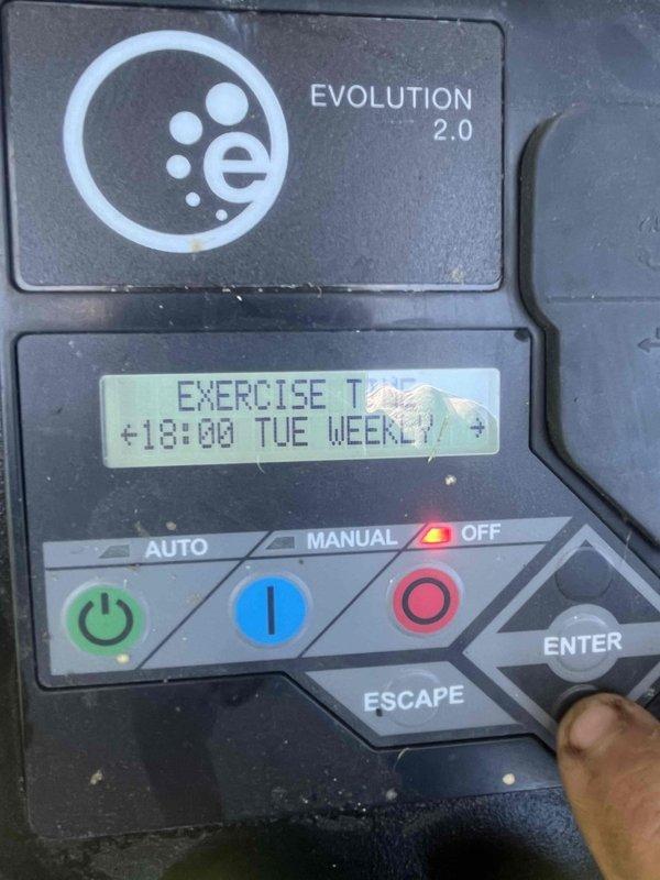 Responded to service call regarding indicator light status on Evolution 2.0 generator system. Upon arrival, performed comprehensive system diagnostics using electronic test analyzer, which confirmed all system parameters within normal operating range with 100% battery charge and passing diagnostic results. Verified generator control panel functionality, reviewed exercise schedule settings showing weekly Tuesday runtime programmed at 18:00 hours, and confirmed AUTO/MANUAL/OFF modes operating correctly. System tested and found to be functioning as designed with no faults present.