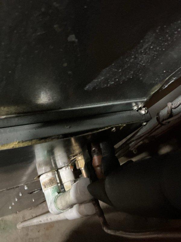 Performed comprehensive system evaluation and second opinion diagnostic inspection of existing HVAC equipment. Conducted thorough visual assessment of air handler components, including filter housing, ductwork connections, and mounting assembly. Inspected condensate drainage system including PVC drain lines, fittings, and drip pan for proper operation and signs of moisture accumulation. Evaluated refrigerant line insulation and copper piping connections for condition and integrity. Documented equipment condition through photographic evidence showing installation configuration, drainage components, and accessible system elements. Provided homeowner with professional assessment findings to assist in making informed decision regarding repair versus replacement options.
