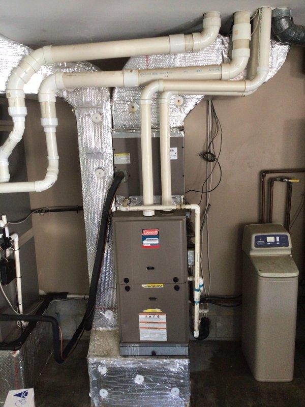 Completed annual maintenance inspection on two-system residential HVAC installation as part of planned maintenance agreement. Performed comprehensive evaluation of 12-year-old Coleman outdoor condensing unit and 1-year-old furnace system. Conducted thorough inspection of both systems including electrical connections, refrigerant levels, airflow measurements, and component operation. Assessed overall system efficiency in response to concerns regarding elevated utility costs. Verified proper operation of all safety controls, checked condenser coil condition, inspected ductwork and PVC drainage systems, and confirmed furnace heat exchanger integrity. Documented equipment conditions with photographic records showing outdoor unit installation on concrete pad with proper clearances and indoor furnace installation with associated water treatment equipment. All systems found operational with recommendations provided for optimizing energy efficiency.