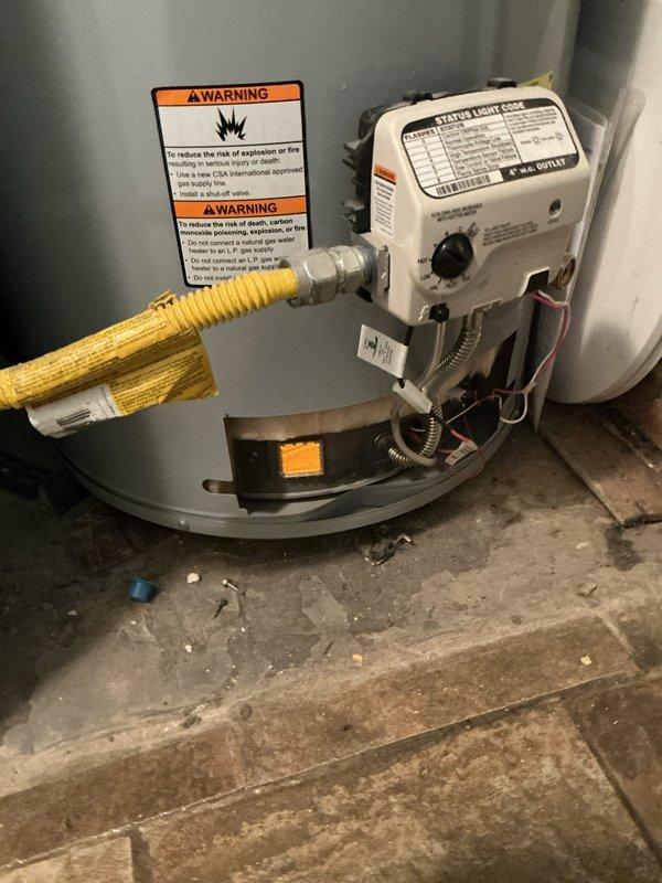 Performed routine maintenance flush on conventional tanked water heater as part of preventative maintenance campaign. Drained sediment buildup from tank bottom to improve heating efficiency and extend equipment lifespan. Inspected gas control valve, flexible gas connector, and safety labels for proper operation and compliance. Verified proper installation of drip pan and documented equipment condition through photographic records. Presented Bronze maintenance plan renewal option to customer for ongoing system protection.