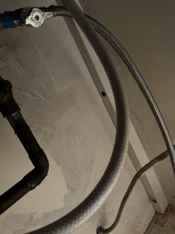 Responded to emergency service call for water leaks following new refrigerator installation. Upon arrival, main water supply was shut off due to active leaks at kitchen sink faucet and refrigerator ice maker supply line. Inspected under-sink plumbing connections and identified dripping from both the kitchen faucet water supply and the refrigerator ice maker line connection point. Tightened compression fittings on the ice maker supply line and kitchen faucet supply connections. Verified proper seating of ferrules and checked all braided stainless steel flex lines for damage or wear. Restored main water supply and pressurized system. Conducted thorough leak check of all connections including P-trap assembly, garbage disposal connections, and supply valves. Confirmed all fixtures operating properly with no active leaks. Educated customer on proper valve operation for future appliance installations. Water service fully restored to residence.