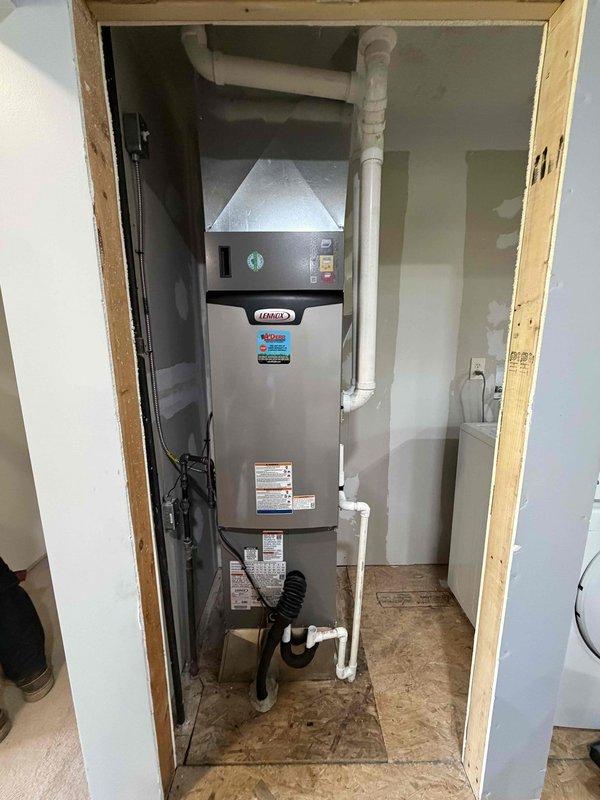 Completed installation of a 2-ton, 15.5 SEER Lennox heating and cooling system with 97% AFUE furnace. Installed new furnace unit in interior utility closet with proper venting using white PVC piping, configured control board DIP switch settings and sensor connections per manufacturer specifications, installed condensate pump with drainage lines, and verified all electrical connections and system operations. All components tested and operational upon completion.